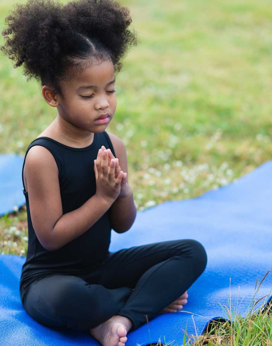 Preschooler meditating